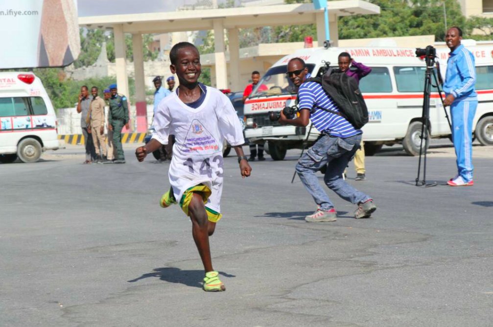 Fatumaabdulahi's tweet photo. Youngest runner at the first mini marathon held in Mogadishu in decades. That smile, that unbreakable spirit. He is #Mogadishu. He is #Somalia. https://t.co/6UjM4Yj1HE
