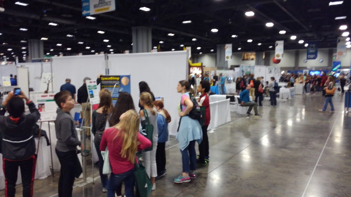 Cosmoneer's tweet image. Our table at #scifest is already swamped!  Go #STEM