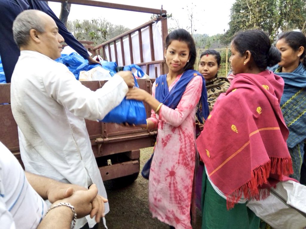 Gurudev's tweet photo. .@ArtofLiving volunteers battled heavy rains and storms to distribute food and clothing to 400 tribal families scattered across the mountainous region of Rani, Assam, which gets cut off from the plains for 4 months during the monsoons. https://t.co/y2aiPZ08KC
