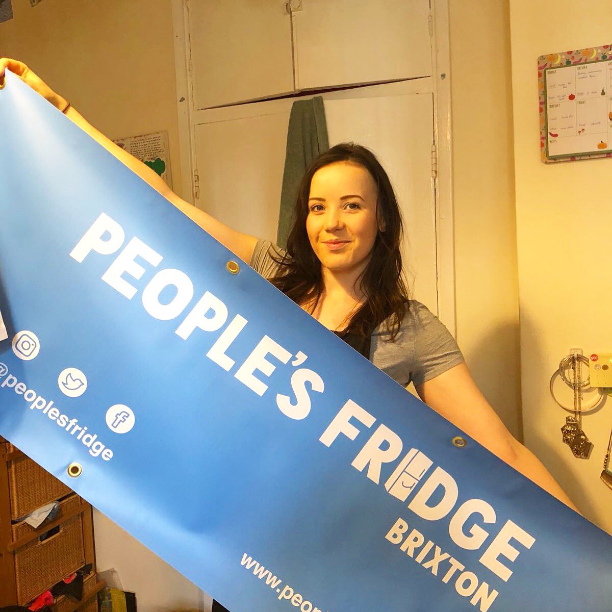 PeoplesFridge's tweet photo. Fridge marketing ace @DottieAllan models our new banner. Come and see as @brixtonfarmersmarket this Sunday (8th April) from 10-2. 

And bring a clean jar. You’ll get a prezzie. https://t.co/jPNghAq2F7