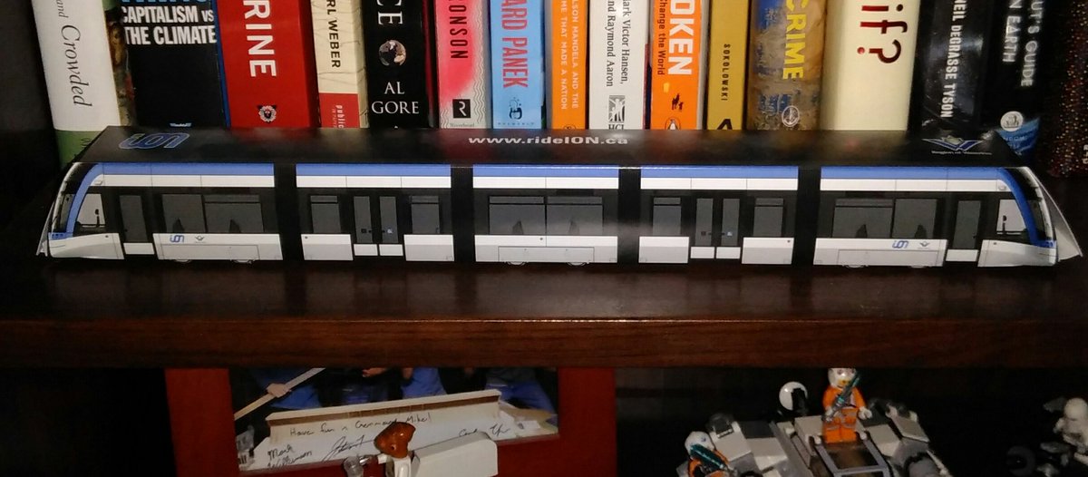 NIsotupa's tweet photo. I didn't catch any real trains this week, but I'm so excited for the new LRT that I have kept this 3D paper model of the new ION train on my book shelf for years in anticipation. #CommutingWeek #carboncleanseWR @AETGroup @rideIONrt https://t.co/ZHWkwImyIW