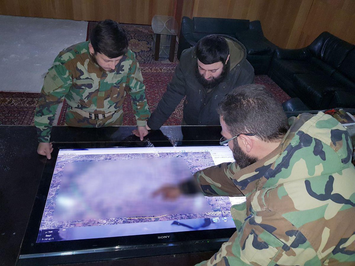 Islamarmy_eng3's tweet photo. In a meeting with the commander of #Jaish_al_Islam "Isaam Buedani" with one of the operations officers to check up the fortification plans to the fronts of #Douma city in the #Eastern_Ghouta. https://t.co/mgcheKfl5k