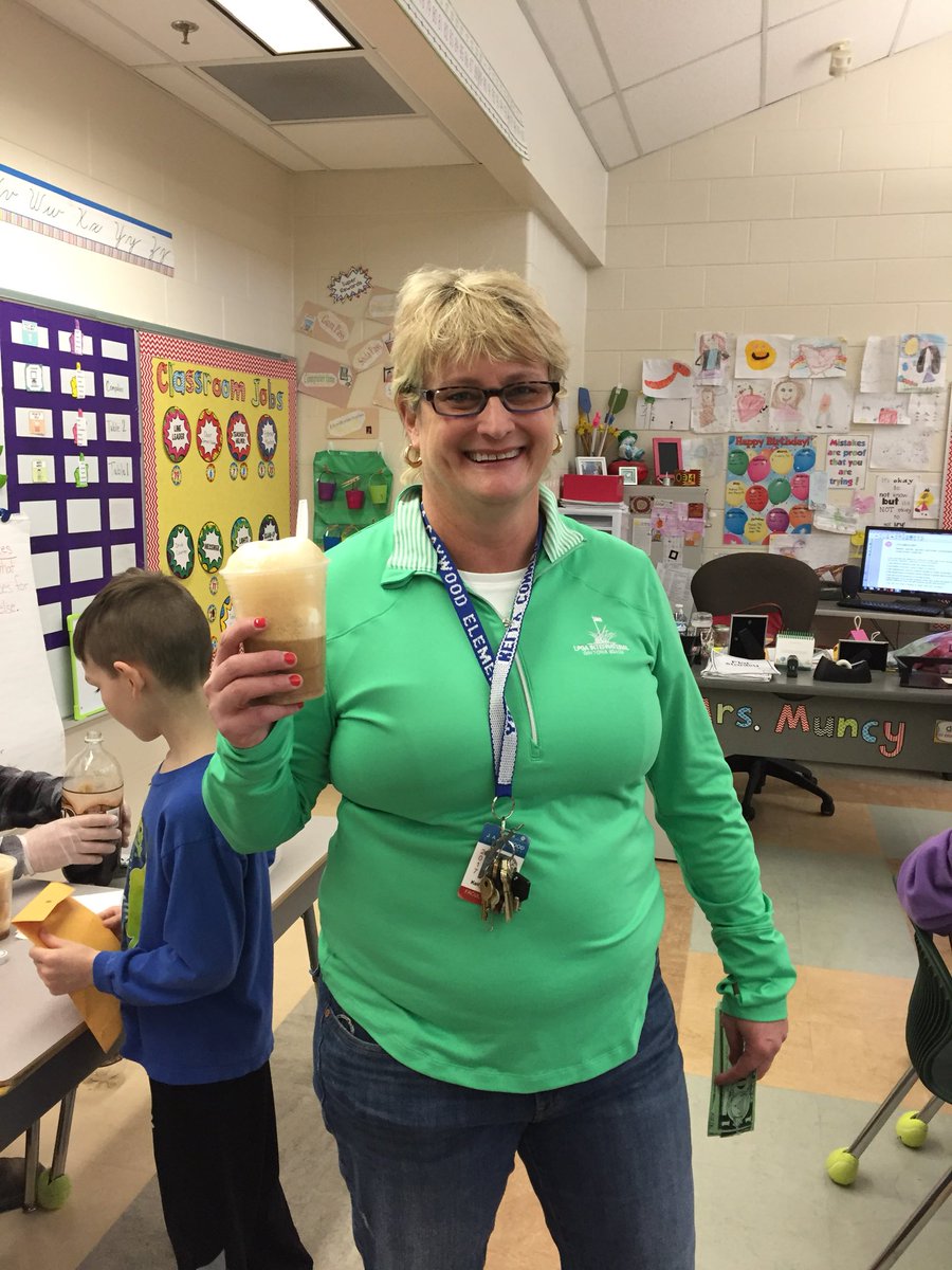 Spending my money wisely at the 2nd grade Goods and Services Fair!  Loving my root beer float!