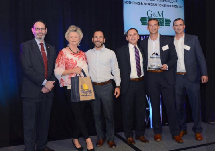 GoehringMorgan's tweet photo. We are proud to announce that Goehring &amp; Morgan has been named the 2018 Best Custom Home Builder by the Orlando Business Journal @OBJUpdate . The award was accepted by Tannis Goehring, Bo Morgan and Kevin Ball. Photo Credit: @MediaLife_OBJ https://t.co/vlVu9A8Lpm