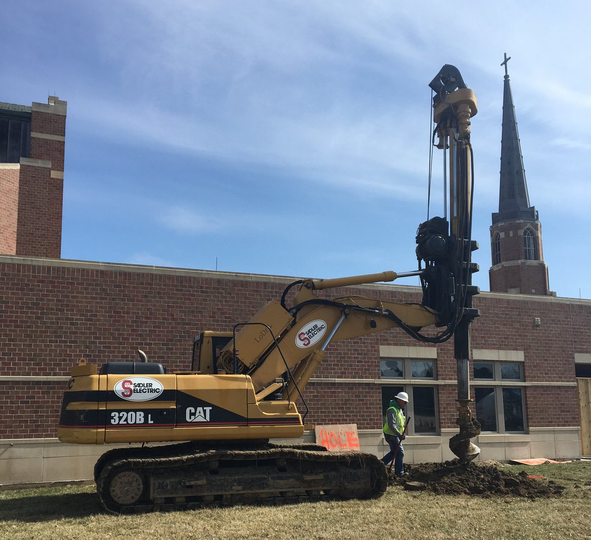 stvdpomaha's tweet photo. Even though the drilling machine is here creating holes for pylons, our  official Groundbreaking Ceremony is this Sunday, April 8 following the  10:45 Mass. Because of the weather forecast, all events have been moved  to the Gym. Please join us for this much-anticipated event! https://t.co/oFjeF7ypmF