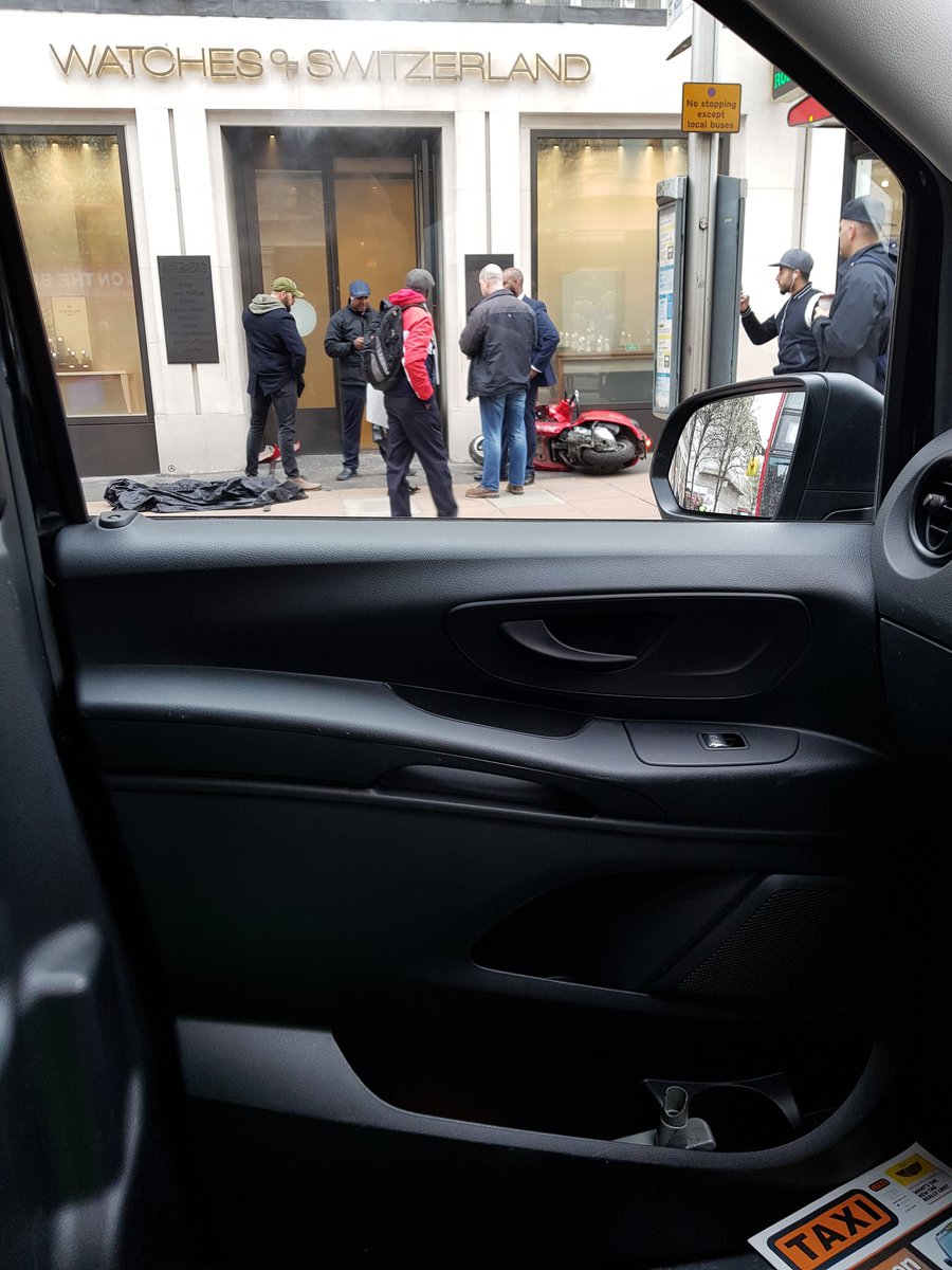 Moped bike gang armed with machetes rob luxury London watch store