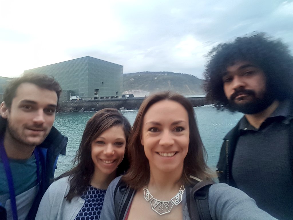 Marjo's tweet photo. See the big building behind us? It's the @KursaalDonostia building, where we're about to hack data during non stop 24hours, for the @icomglobal #DataScience #hackathon!!! 
Final count down : it's starts in exactly 1h.🙃
Let's gooooooooo!!
#icomhackathons18 #icom18 https://t.co/KX4oRCRQuo