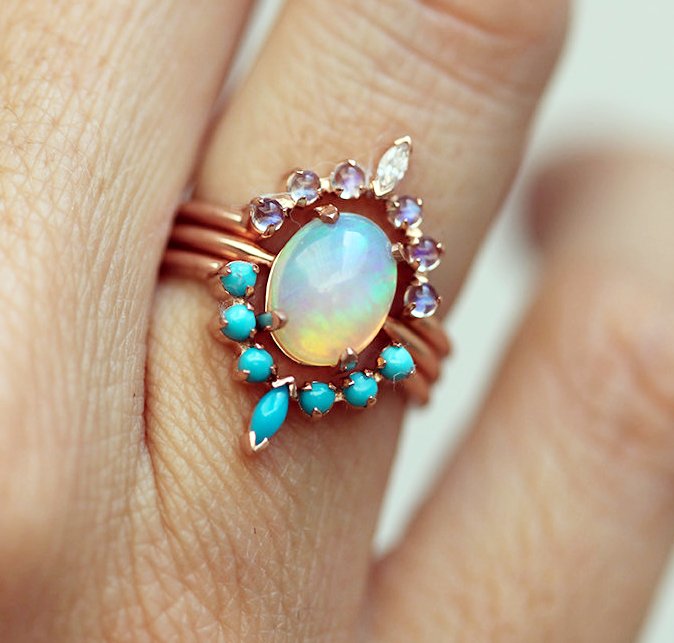 Ocean Engagement Ring, Solitaire Fire Opal, Moonstone Ring, Curved Turquoise Band unusualengagementringsreview.com #ocean #fire #opal #moon #stone #fireopal #moonstone #curved #solitaire #diamond #engagementring #engagement #ring #weddingring #wedding #peace #love #faith #family #unity