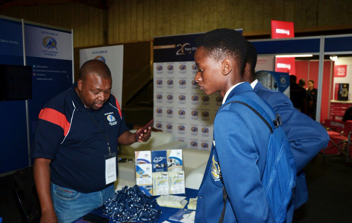 OfficialSACAA's tweet photo. Day 5 of the #Randshow2018 started on a high note as young #Aviators from Badirile High School descended upon the #SACAA stall. Elias Motloung, Airports &amp;Airlines inspection is seen engaging learners on the various opportunities in aviation.
 #20yearsofkeepingyousafeinthesky https://t.co/omYOpXdQ6a