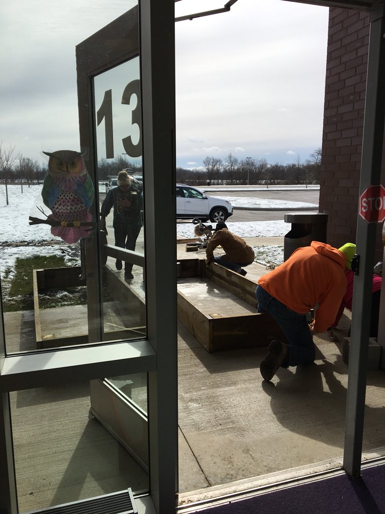 lgaughenbaugh's tweet photo. Even the snow won’t stop us from building our raised beds @Summit STEM. #reynproud https://t.co/2cvLx7IbEu