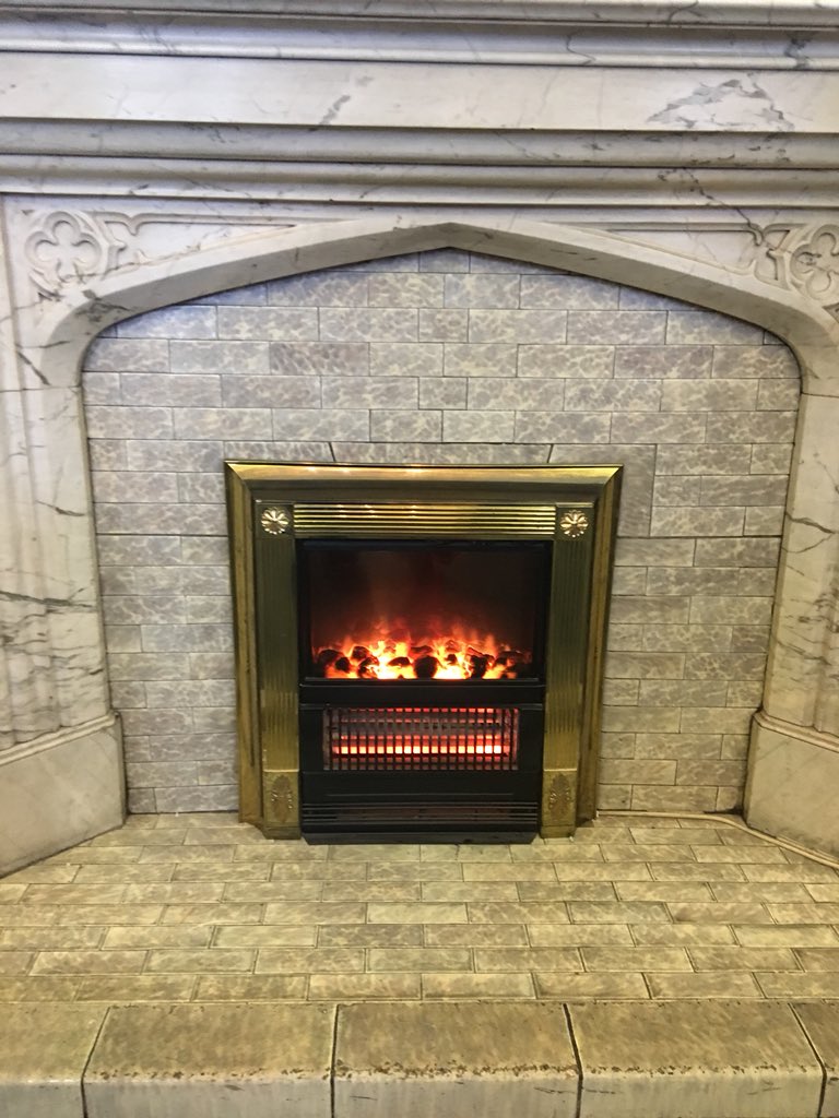 ProfKarenSayer's tweet photo. It seems very appropriately have an old electrical fire, retrofitted into an old fireplace in the room in which I just presented in the History of energy #ESSHC2018 https://t.co/H02W5xqrvz