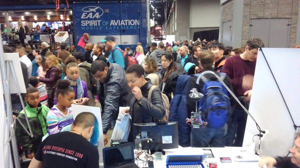 Cosmoneer's tweet image. The Honda #Asimo exhibit lets out and we get swamped!