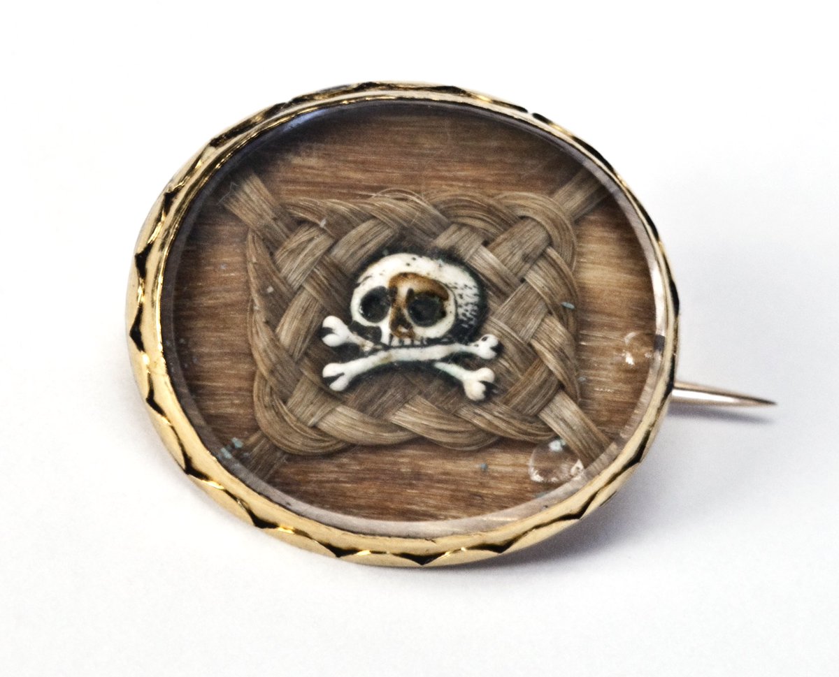 MutterMuseum's tweet photo. The oldest piece in #WovenStrands is also one of the smallest. This Memento Mori brooch from 1681 is about 1 inch across and is made of gold, Stuart crystal, human hair, and enamel (perhaps bone). Join our celebration of this exhibit at https://t.co/U7bU65ZwAH https://t.co/a6JSpgaosm