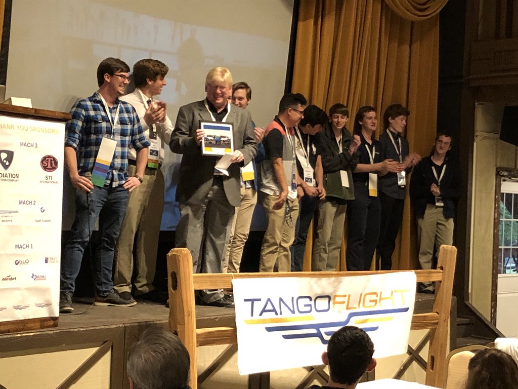 GeorgetownISD's tweet photo. Students in the aerospace engineering program present instructor Dan Weyant with a painting of their student-built #tangoflight plane tonight, an RV-12. These kids are #FutureReady #SkysTheLimit https://t.co/HIfrbWMvid