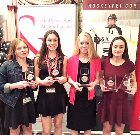HockeyPEI's tweet photo. Congrats to the award winners at the @2018BanFemATL awards banquet. L-R: Rachel Richards Top D (Mid Isle); Emma Langley Top Forward (Mid Isle), Lucy Phillips Top Goalie (Metro West Force) and Jillian Duggan of Metro West Force, MVP and top scorer. #shecanyoucan https://t.co/pDpgfJLBvx