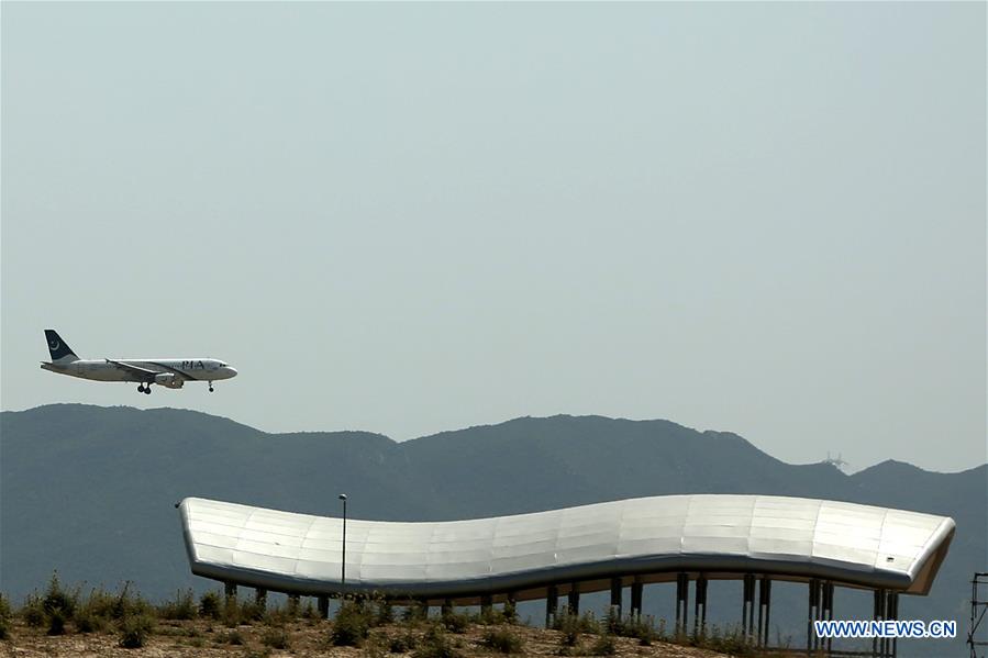 PDChina's tweet photo. The new Chinese-built international airport in #Islamabad, capital of Pakistan, welcomed its first plane during a scheduled mock flight to test operations on Saturday local time. https://t.co/tcidKNwcRK