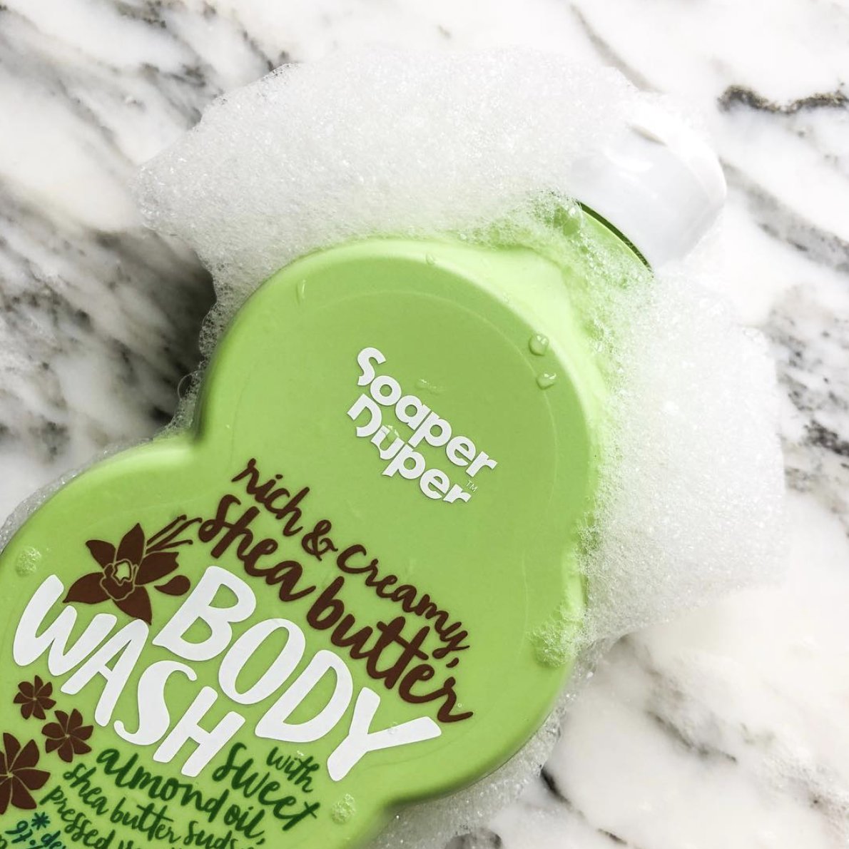 How is it that this small, but well-styled still life of our shea butter Body Wash can almost immediately instil bathroom envy in even the most detached of viewers. Is it the suds? The energy of the green? That fabulous marble?
Who can compete with this?