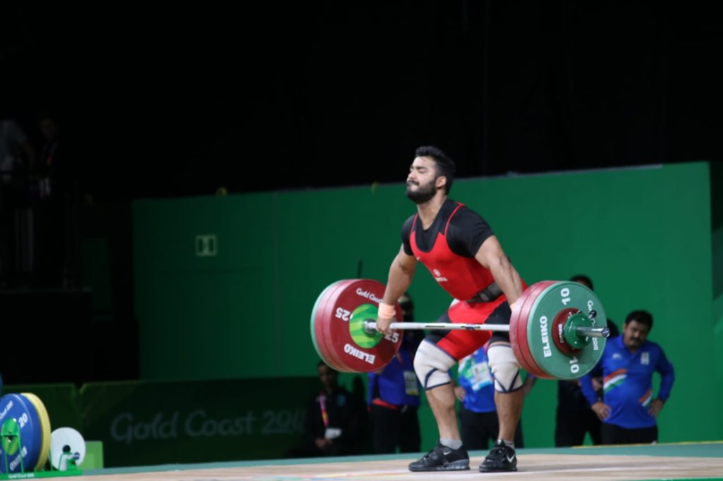 PMOIndia's tweet photo. More glory thanks to our weightlifters. Congratulations Vikas Thakur for the Bronze in the men's 94kg event. You have brought smiles on the faces of all Indians: PM @narendramodi #GC2018 https://t.co/IDM7JVSoeF