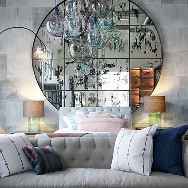LOVE everything from this bedroom set up from @myciscohome stores in the US. That grand scale mirror literally off the scale  and I love the contrast of grey sofa and concrete walls with the little soft pops of colour in the glass lighting and cushio… bit.ly/2uVOIp5