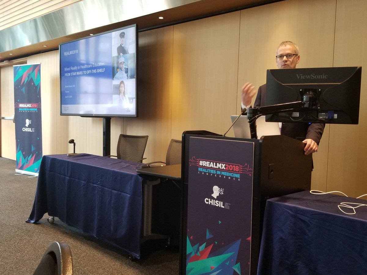 DrFadiTO's tweet photo. @CAEHealthcare 's president Dr. Robert Amyot enlightening the Realities in Medicine conference on how they are transforming healthcare! #REALMx2018 @RealitiesinMedx @ChisilARVRMR @UoTAnesthesia @uoftmedicine @Sunnybrook @SickKidsNews https://t.co/t76mlIqxOw