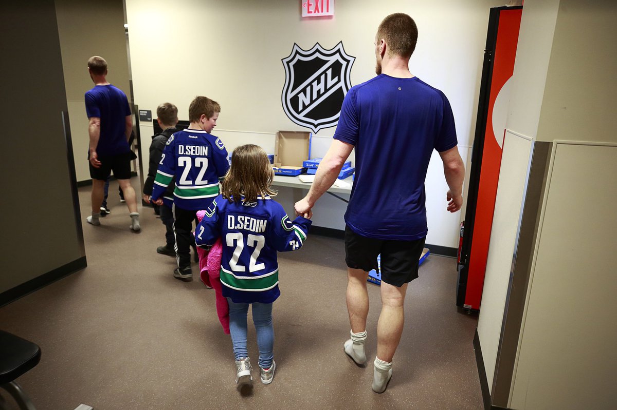 Canucks's tweet photo. When all was said and done last night, the Sedins spent time how it mattered most. #ThankYouSedins https://t.co/IDyGK4sLcF