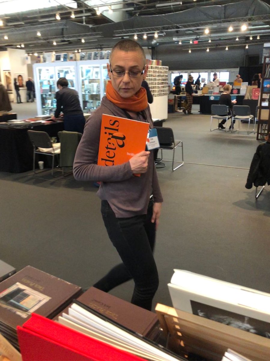 BrilliantGrafix's tweet photo. Julie Grahame from the American Photography Archives Group enjoying our latest LayFlat piece! #AIPAD2018 https://t.co/KR66xbWqIy