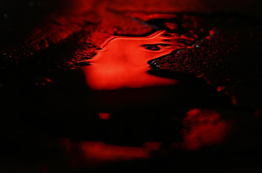 Bright lights, big city, rainy London. Neon reflections of <a href="/royalcourt/">Royal Court</a> in Sloane Square ...