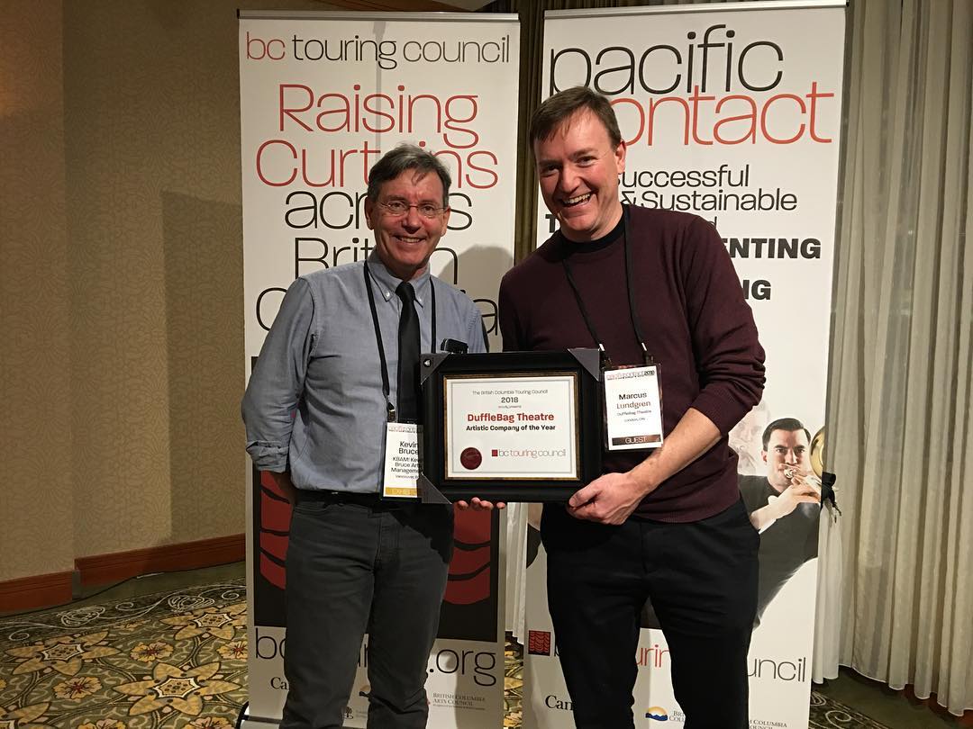 Last night at Pacific Contact in lovely Burnaby, DuffleBag Theatre was recognized with 2018's BC Touring Council Artistic Company of the Year Award!
Here's Marcus along with our incomparable booking agent, Kevin Bruce from KBAM!, who helped make this possible. Thanks, BCTC!