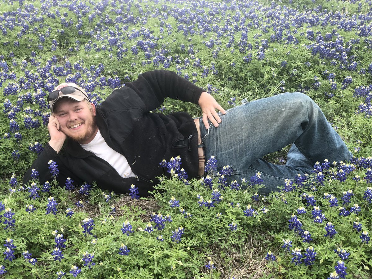 dariand8's tweet photo. My mom just convinced my brother to pull over on the side of the interstate to take some nice pictures in a patch of blue bonnets and this is how he posed. https://t.co/ztck38uRmy