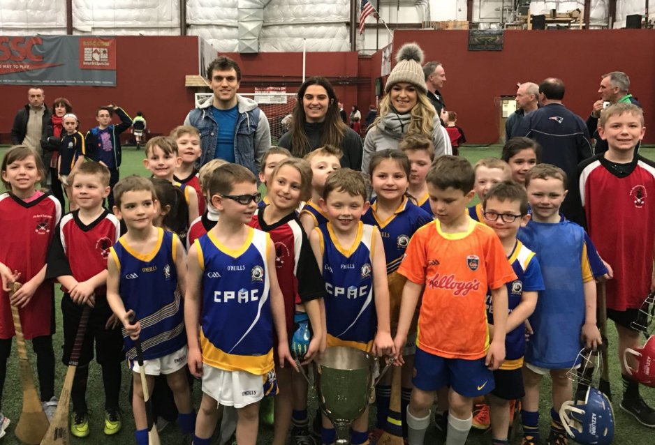 GPABoston's tweet photo. Players giving back and growing the game! This morning, @townhurler @wayneen22 and @Niamh_Collins spent time with @GAABoston youth... and brought the #playerschampionscup along! @GAA_USA @FenwaySportsMgt @RedSox @AIGinsurance #weseepeople https://t.co/m1nKcwIDQ6
