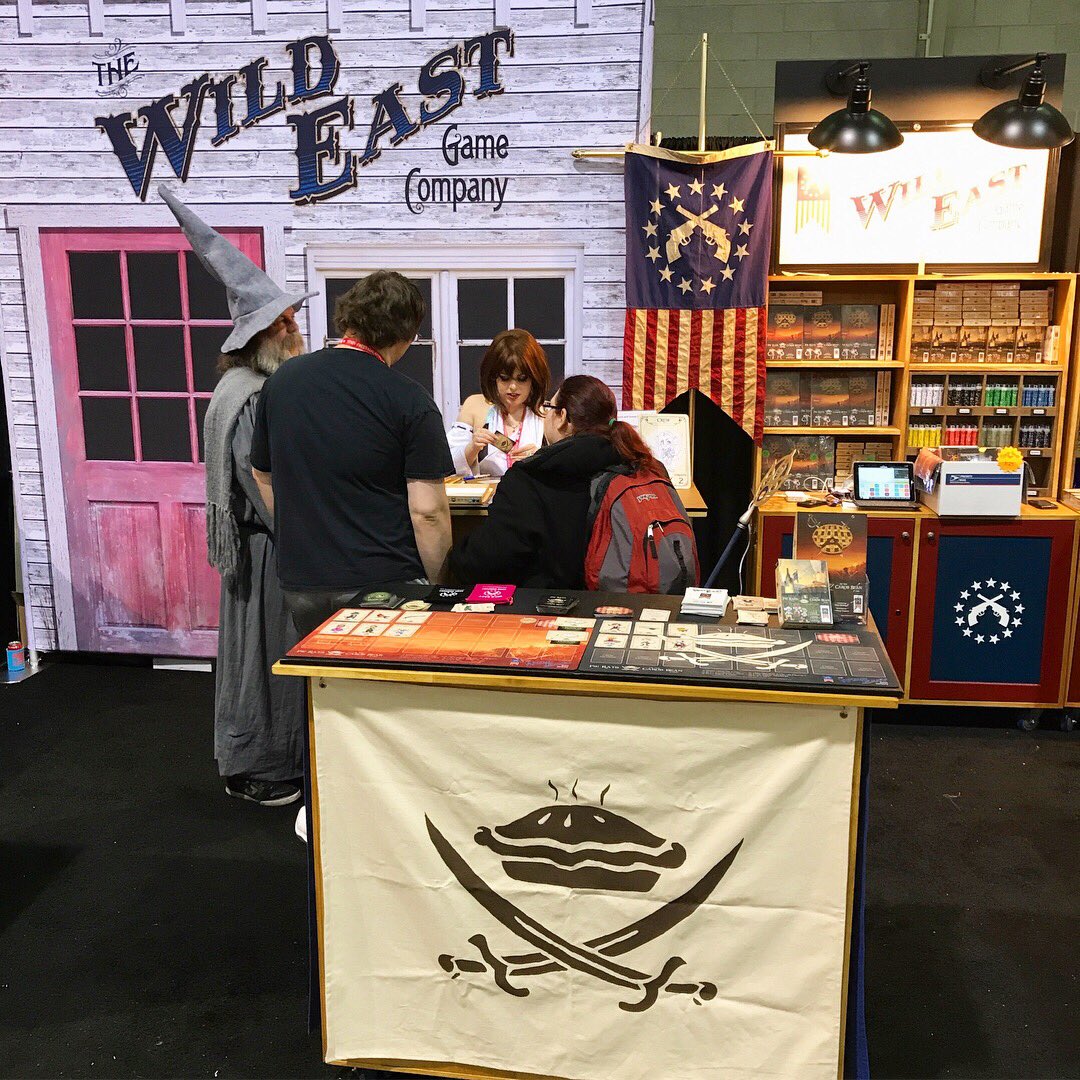 WildEastGames's tweet photo. Having fun here in booth 10100! Stop by and get Britany the Artist and Brian the creator to sign a promo card or box set! #PaxEast2018 https://t.co/WtaTvUVV6c