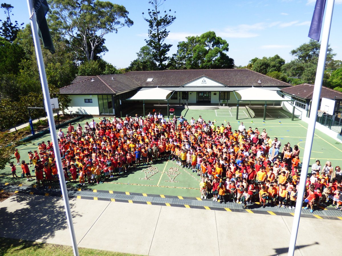 Today, the Prep School celebrated Harmony Day and participated in Mission Fundraising.  Here the School is pictured around a Harmony Day installation they have created from stones.
