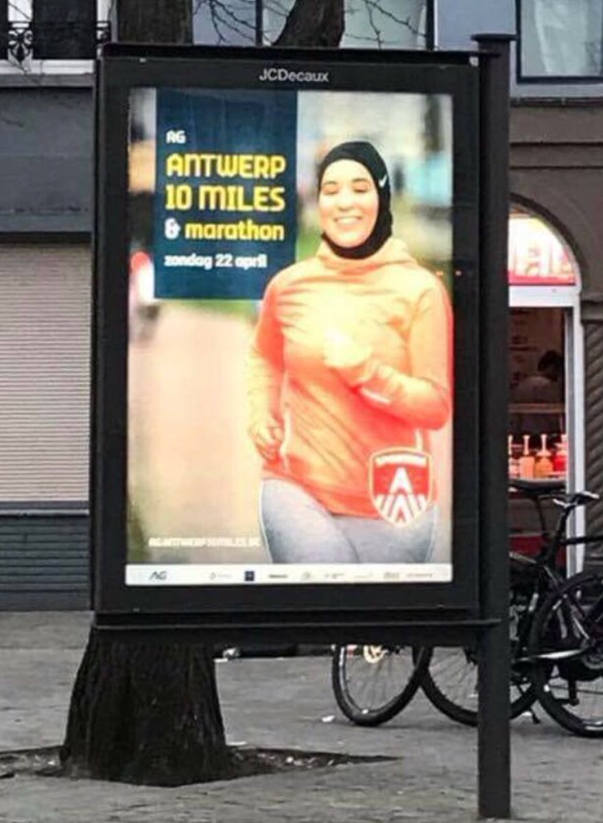 FDW_VB's tweet photo. Antwerps stadsbestuur promoot via @SportingA_ hoofddoek met affiches v/ joggende en volledig bedekte moslima. #10miles Islamcollaboratie! https://t.co/GUlFuAAPMO