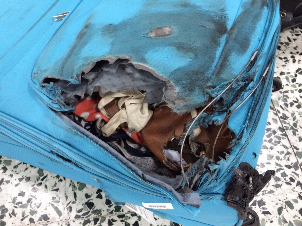 Georgia__O's tweet photo. Turned up to Cyprus to find my suitcase smashed in. So @TUIUK gave me 50 euros to buy a new one. Waiting at the airport this morning to find this suitcase completely burnt! And has burnt through part of my luggage. Very worrying that this can even happen! https://t.co/V7wkQOCptl