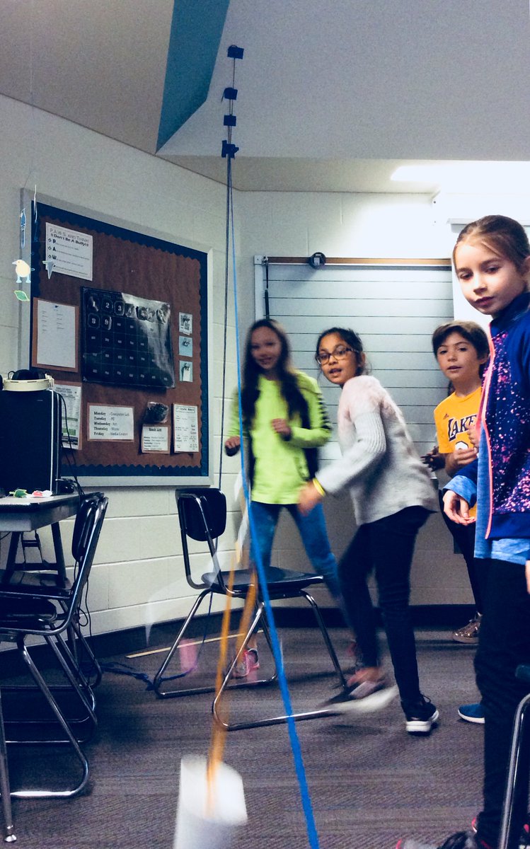 MrSchulenborg's tweet photo. Today students followed the steps of the engineering design process to construct simple machines.  Tomorrow we'll graph speed and find patterns in the data when their creations zip line down our wall.  #7.10 https://t.co/dvvJ2Sp2JR