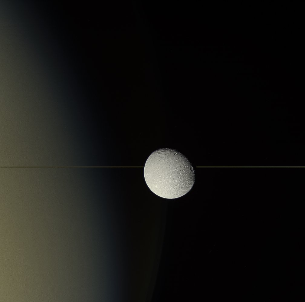 Dione On the Edge. For all their immense width, Saturn’s rings are razor thin when viewed edge-on, as in this 2015 view of Saturn’s moon Dione. go.nasa.gov/2Ex3RNf