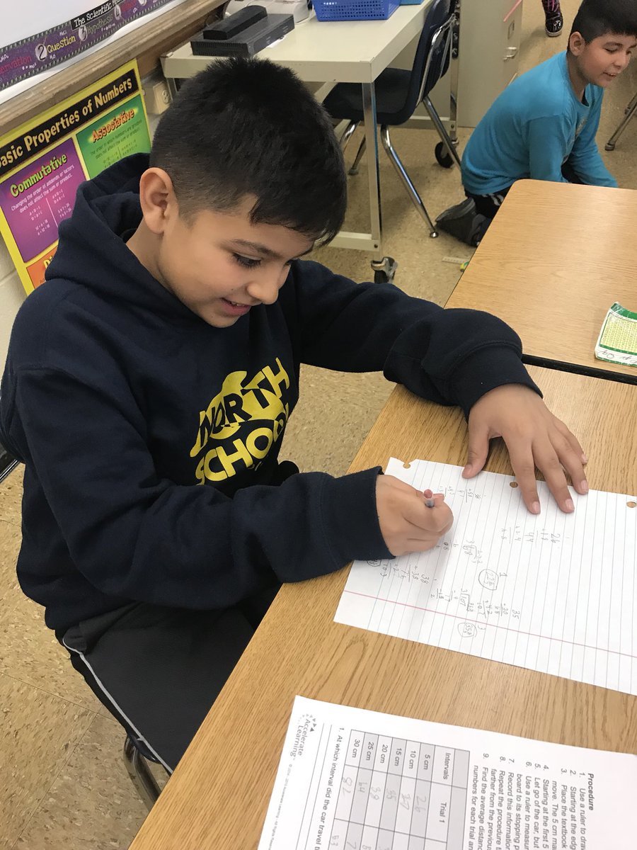 MrsAirdo's tweet photo. We’re using our long division skills we learned in math to help us learn about energy and speed in science! #D84OnTrack https://t.co/10SGfV2Ost
