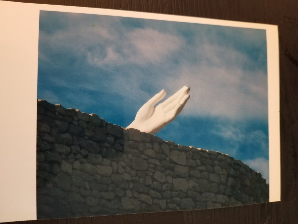 MeredithAKatz's tweet photo. So I... was sorting through some of my books and a couple of pictures fell out from between two books. They're photographs, or at least, they were printed on photo paper. Neither my wife or I have ever seen them before. #definitelycursed https://t.co/CiRzz8MWZE