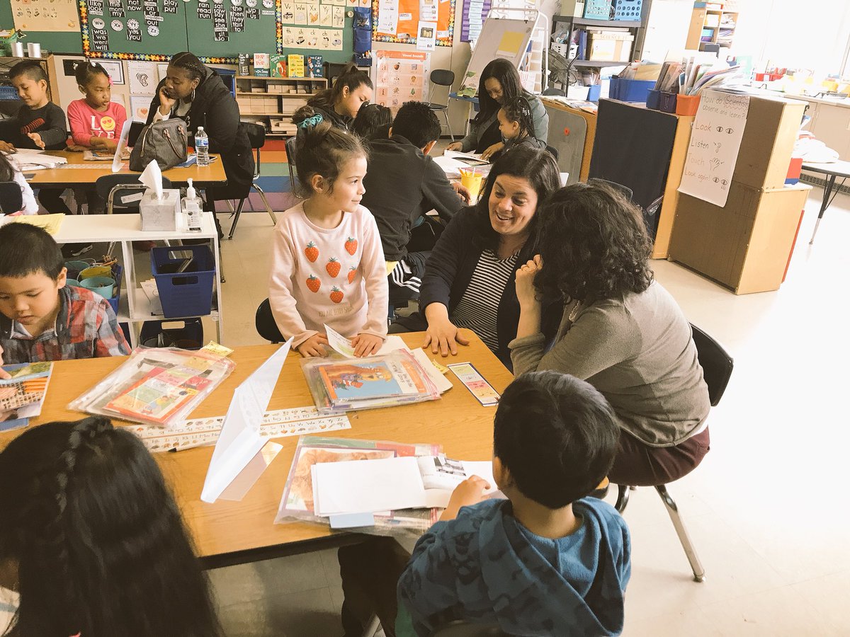 Ms_Maloney_'s tweet photo. WOW! What an awesome APTT event! Families &amp; kids practicing using their reading Super Powers in the classroom today! 🎉 Thank you families! https://t.co/abeofF2qTv