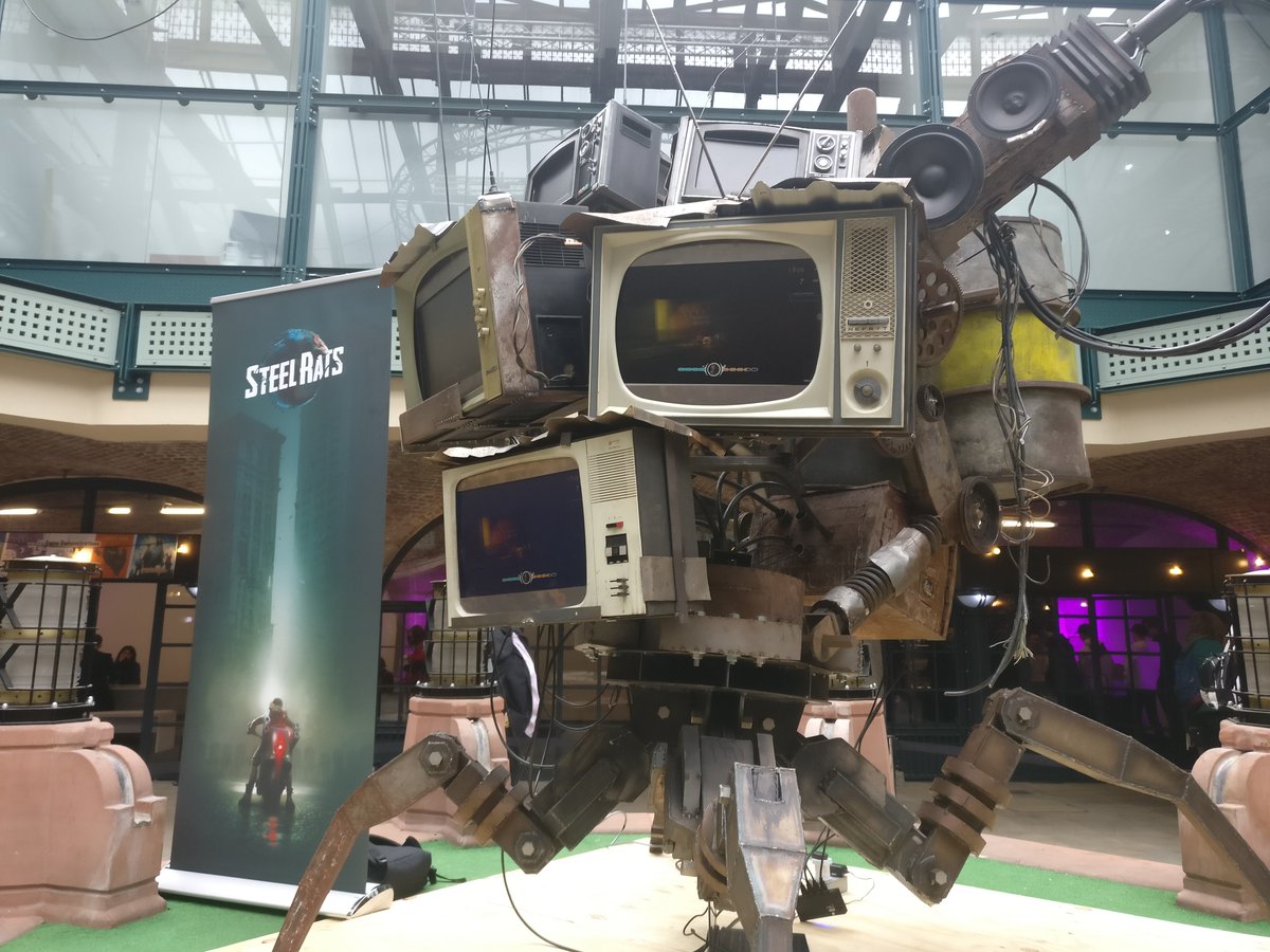 ReadyUp's tweet photo. Oh, we forgot to post this at the weekend: an extremely cool prop for #SteelRats, visible at #Rezzed2018! The game, a 2.5D motorbike action title, looks pretty cool, too. @EGX @MsVeronicaVance https://t.co/NhhUJCVMcO