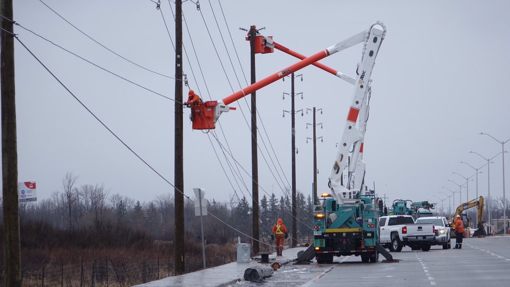 GiacomoPanico's tweet photo. Hydro Ottawa crew at Limebank tell me they’re hoping to reopen road by PM rush hour. 20 poles needed replacing #ottnews https://t.co/zUhM0ksv2o