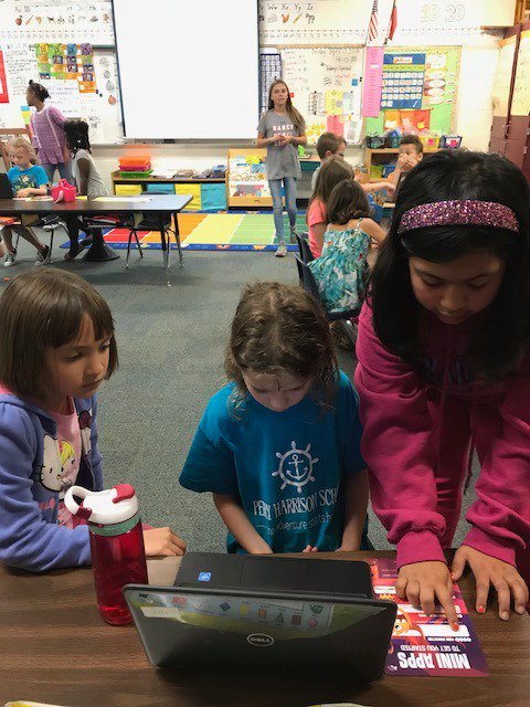 Friendship code girls sharing coding knowledge with first grade students.<a href="/GirlsWhoCode/">Girls Who Code</a> @GirlsinTech
