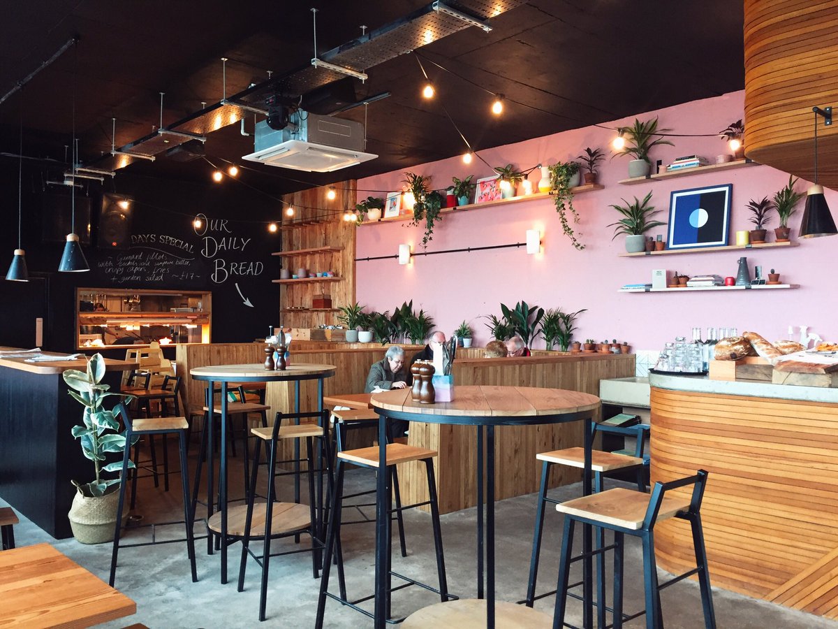 WanderingCoast's tweet photo. Finally got around to checking out Swim, the new cafe bar on the beach at Lyme Regis. We loved the Palm Springs vibe! Our own slice of SoCal, here in West Dorset. We appreciated the generous choice of vegan food too. https://t.co/yxJy72huYc