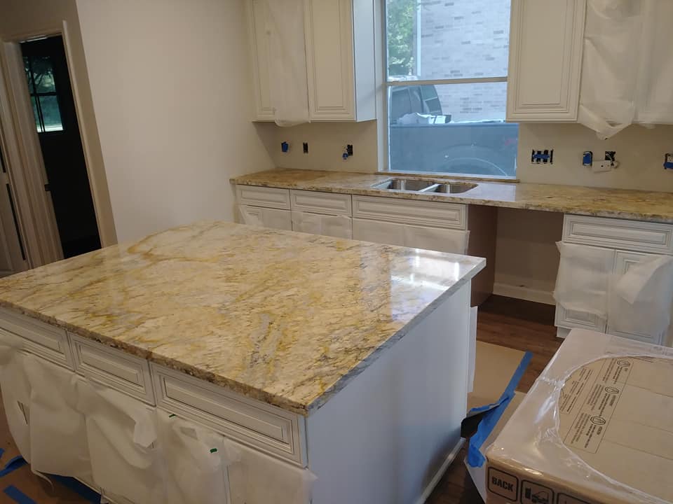 GraniteKingLBK's tweet photo. Here is one of our exotic colors of granite that has some movement to it. This rock is called Giallo Twister Gold. We love the granite around the fireplace! https://t.co/SghB98Capv