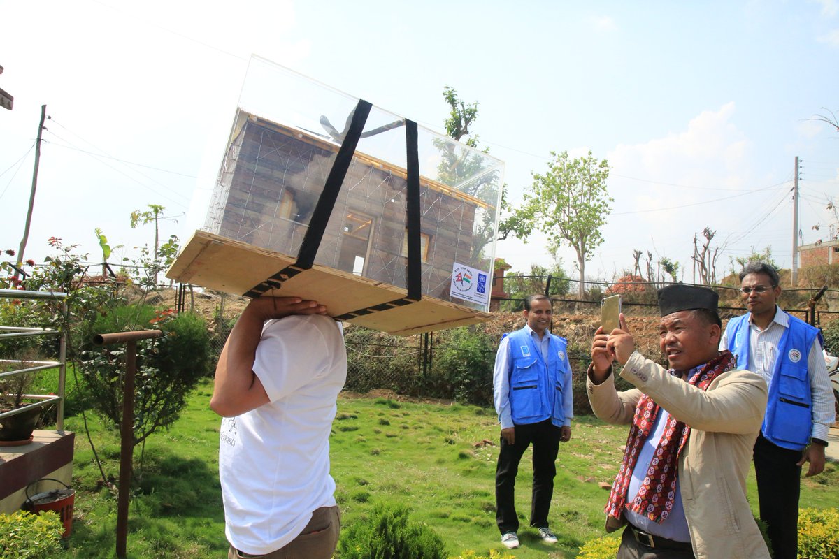UNDPNepal's tweet photo. #SmartSnap: SantoshGurung, Chair of Dharche Rural Municipality, #Gorkha snaps pictures of replica of a #LowCostHouse being taken for a demo @ newly-opened #BuildingPermitStudio in Gorkha. Approved by Govt, the GI-Wire model is quake-resilient, eco-friendly & affordable. https://t.co/8njGTg5GE6