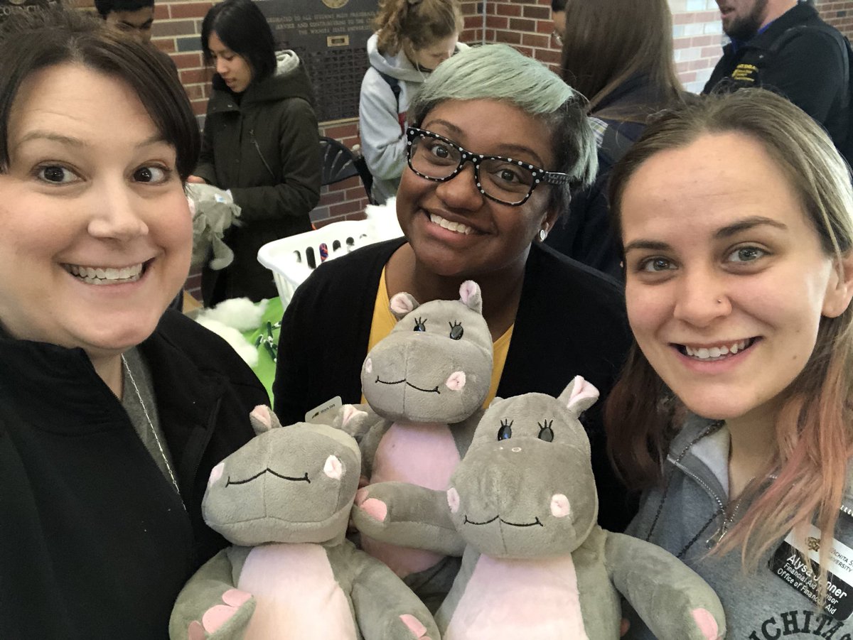 shockerfinaid's tweet photo. Financial Aid Advisors @teganjperry and @alysajolie along with Assistant Director of Undergraduate Admissions @RickiEllison stuffed a Huxley the Hippo today in honor of Hippodrome Week! #ThanksSAC https://t.co/XJ3VOEKtyO