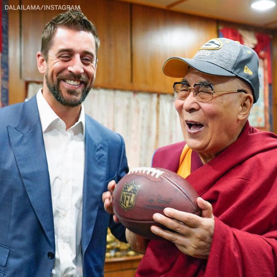 Aaron Rodgers gave the Dalai Lama a football and a Green Bay Packers hat and LOOK AT THEIR SMILES.