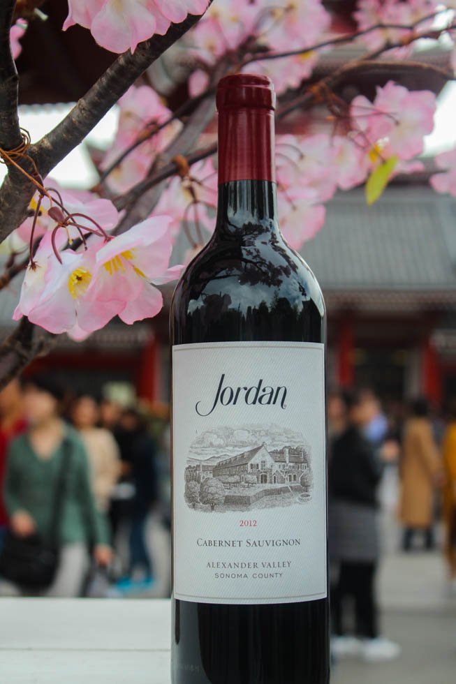 jordanwinery's tweet photo. Looks like one of our Jordan bottles made it to Tokyo just in time for cherry blossom season. Tag your Jordan travel photos with #travelwithjordan to be featured.  #TravelTuesday https://t.co/xuHjqv7XIK