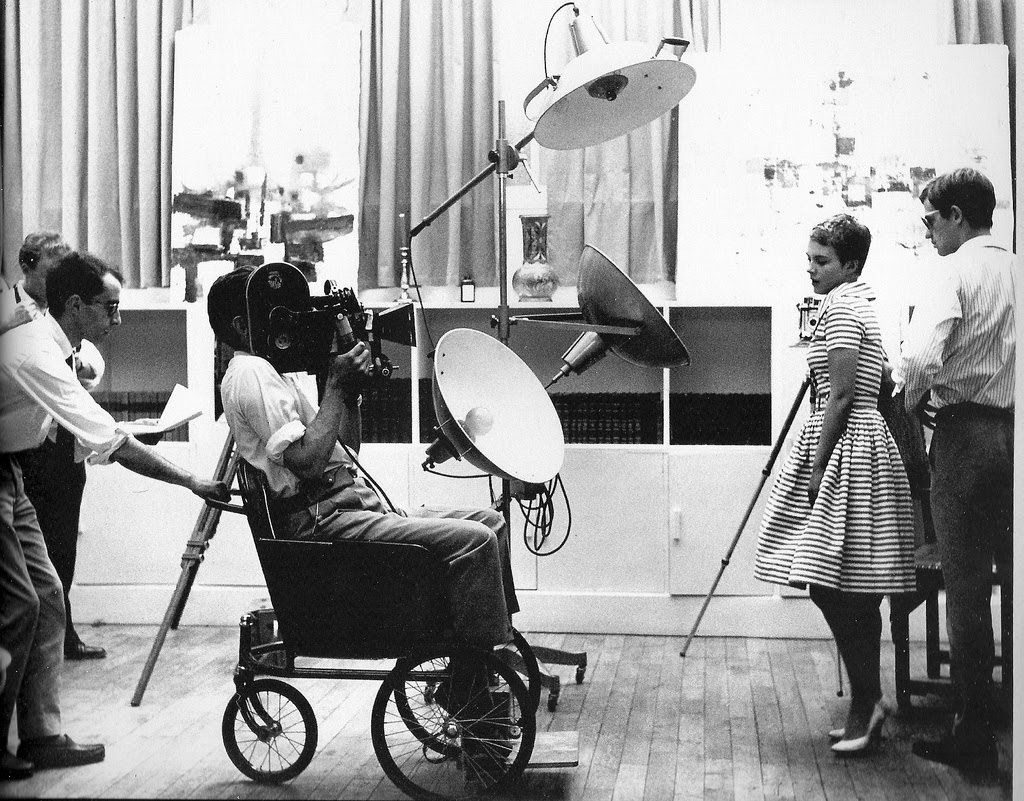 When old-school was new... Jean-Luc Godard pulls cinematographer Raoul Coutard in a wheelchair while directing BREATHLESS (Paris, 1959)