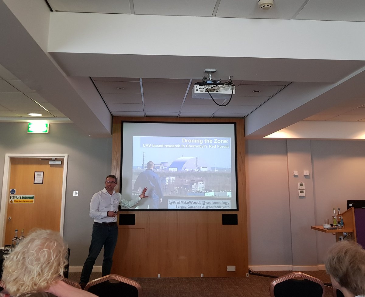 PhakphumA's tweet photo. Third @EERCSalford presentation at #COGER2018 - @ProfMikeWood presents droning the zone in Chernobyl's red forest worked with @radioecology https://t.co/6eI4Mk86G3